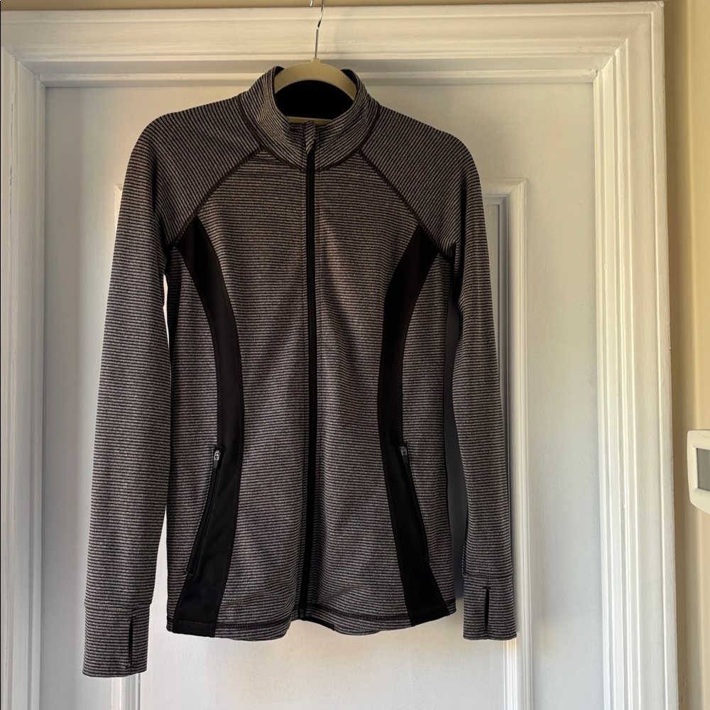 Striped Zip-Up Jacket with Zippered Pockets in Black and Gray.